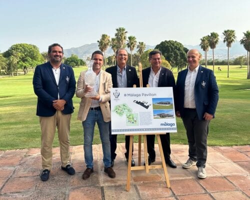 A group of men showing well-being while posing for a photo in front of a golf course.
