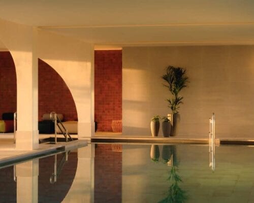 A gymnasium with indoor swimming pool.