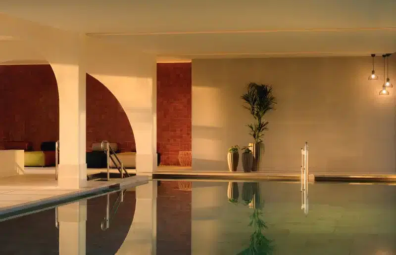 A gymnasium with indoor swimming pool.